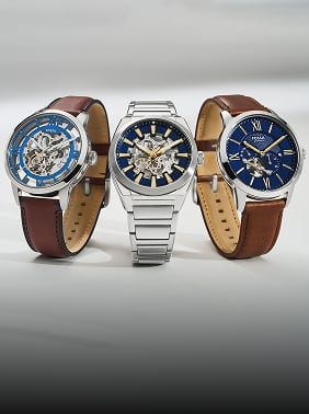 Three Automatic Watches with blue dials on a silvery background.